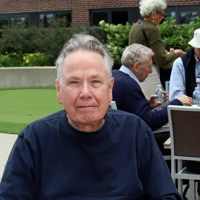 Resident enjoying time outdoors with fellow residents
