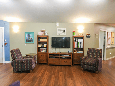 Cozy common area with seating and TV