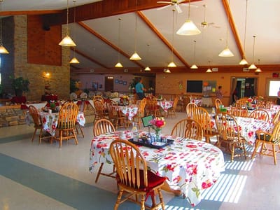 Interior dining room setup with floral tables