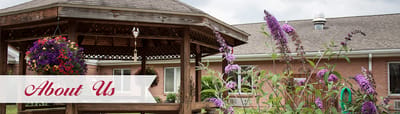 Outdoor gazebo surrounded by flowers at the facility