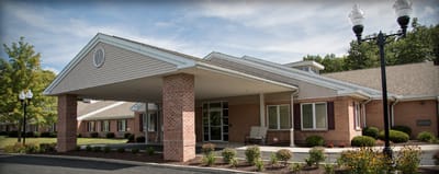 Exterior view of Elkins Rehabilitation & Care Center entrance