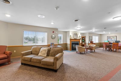 Common area with seating and fireplace in the facility
