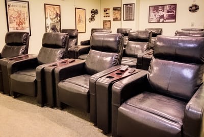 Cozy viewing room with reclining chairs