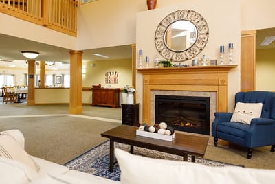 Interior common area featuring a cozy fireplace and seating