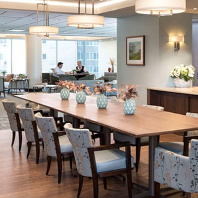 Bright common area with residents and seating