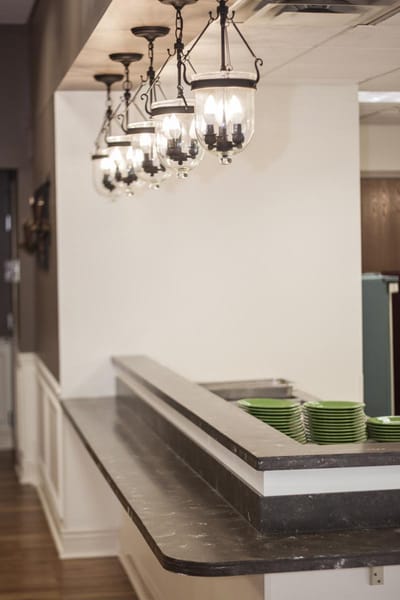 Dining area with pendant lights and serving counter