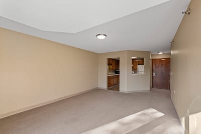 Spacious interior of a resident suite with kitchen view