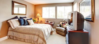 Cozy resident room with a bed and seating area