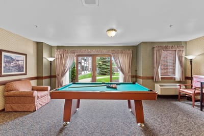 Interior view of a common area with a pool table