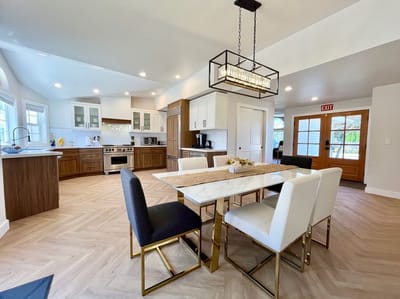 Brightly designed common area with a dining table
