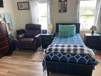 Cozy private room with bed and seating area