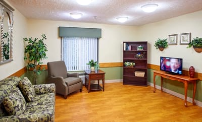 Cozy common area with seating and TV