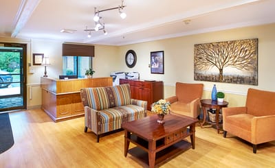 Bright common area with seating and artwork