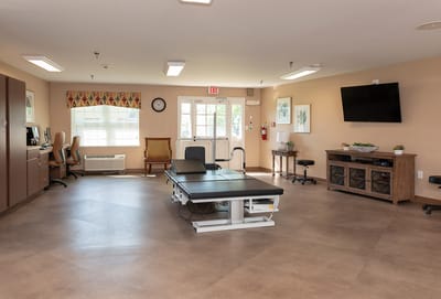 Bright therapy room with rehabilitation equipment