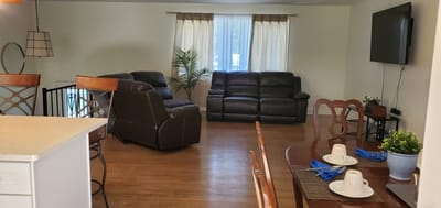 Cozy living area with comfortable seating and dining setup