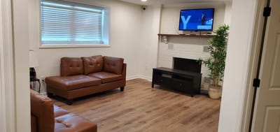 Cozy interior lounge area with a sofa and TV