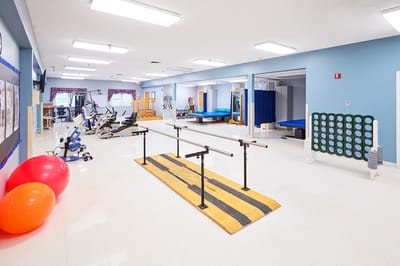 Bright, spacious rehabilitation gym with exercise equipment