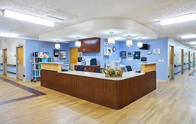 Bright reception area with a wooden front desk
