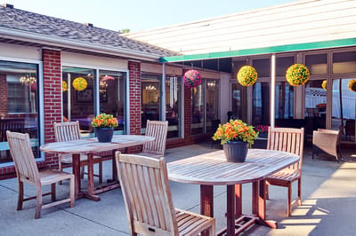 Outdoor seating area with flowers and plants
