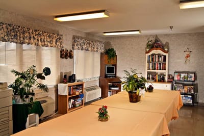 Interior view of a common area with books and plants