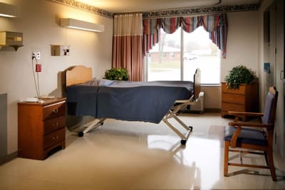 Private resident room with bed and window