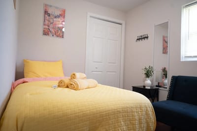 Cozy resident room with yellow bedding and decor