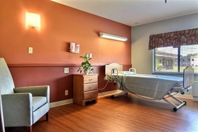 Cozy private resident room with bed and seating area