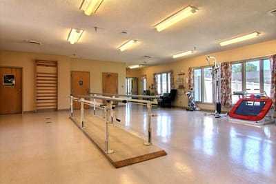 Interior view of a rehabilitation activity room with equipment