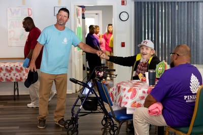 Staff interacting with a resident in a common area