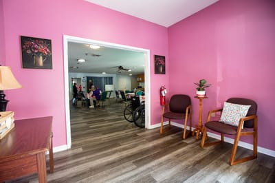 Bright interior space with purple walls and chairs
