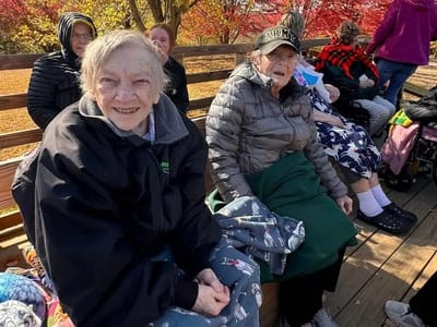 Two senior residents enjoying time outdoors