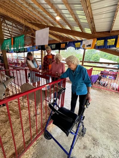 Residents interacting with animals at a facility event