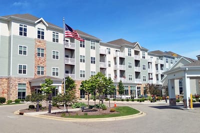 Exterior view of an assisted living facility with landscaping
