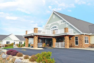 Exterior view of an assisted living facility with landscaping