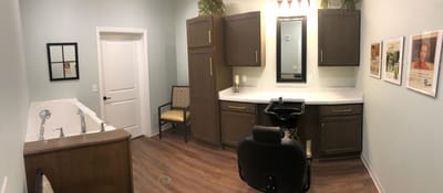 Interior of a salon area with styling chair and sink