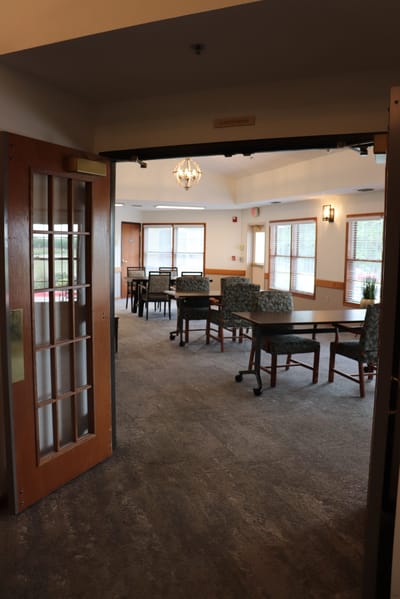 Interior view of a common area with tables and chairs