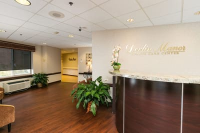 Reception area of Devlin Manor with plants and decor