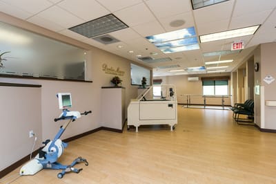 Interior view of a rehabilitation space with exercise equipment