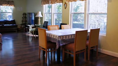 Bright dining area with wooden table and chairs