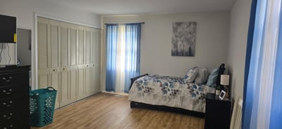 Cozy resident room with bed and seating area