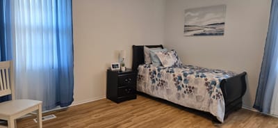 Cozy private room with bed and decor