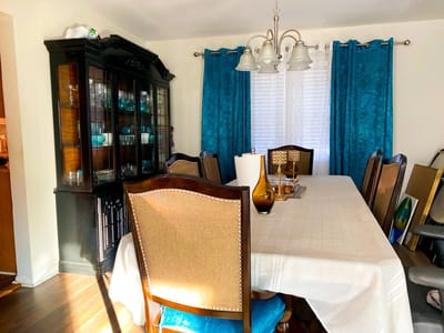 Bright dining room with a large table and chairs