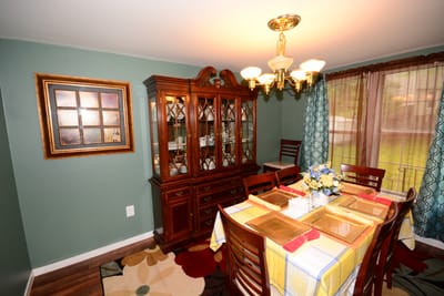 Cozy dining room setup with a table and hutch