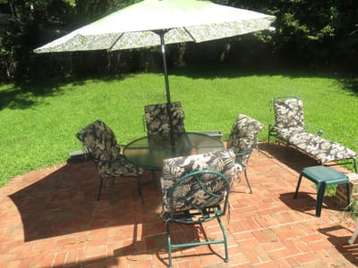 Outdoor patio with seating and umbrella