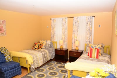 Cozy resident room with two beds and decor