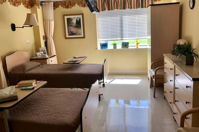 A shared resident room with beds and decor