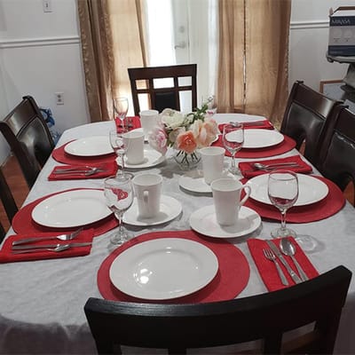 Well-set dining table with plates and glasses