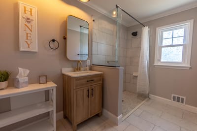 Modern bathroom with shower and wooden vanity