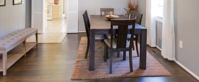 Modern dining area with a wooden table and chairs