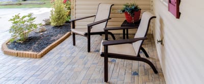 Outdoor seating area with chairs and flowers
